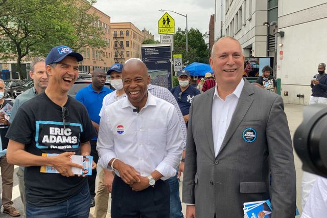 A photo of Eric Adams flanked by supporters Ydanis Rodriguez (left) and Adam Clayton Powell IV (right)